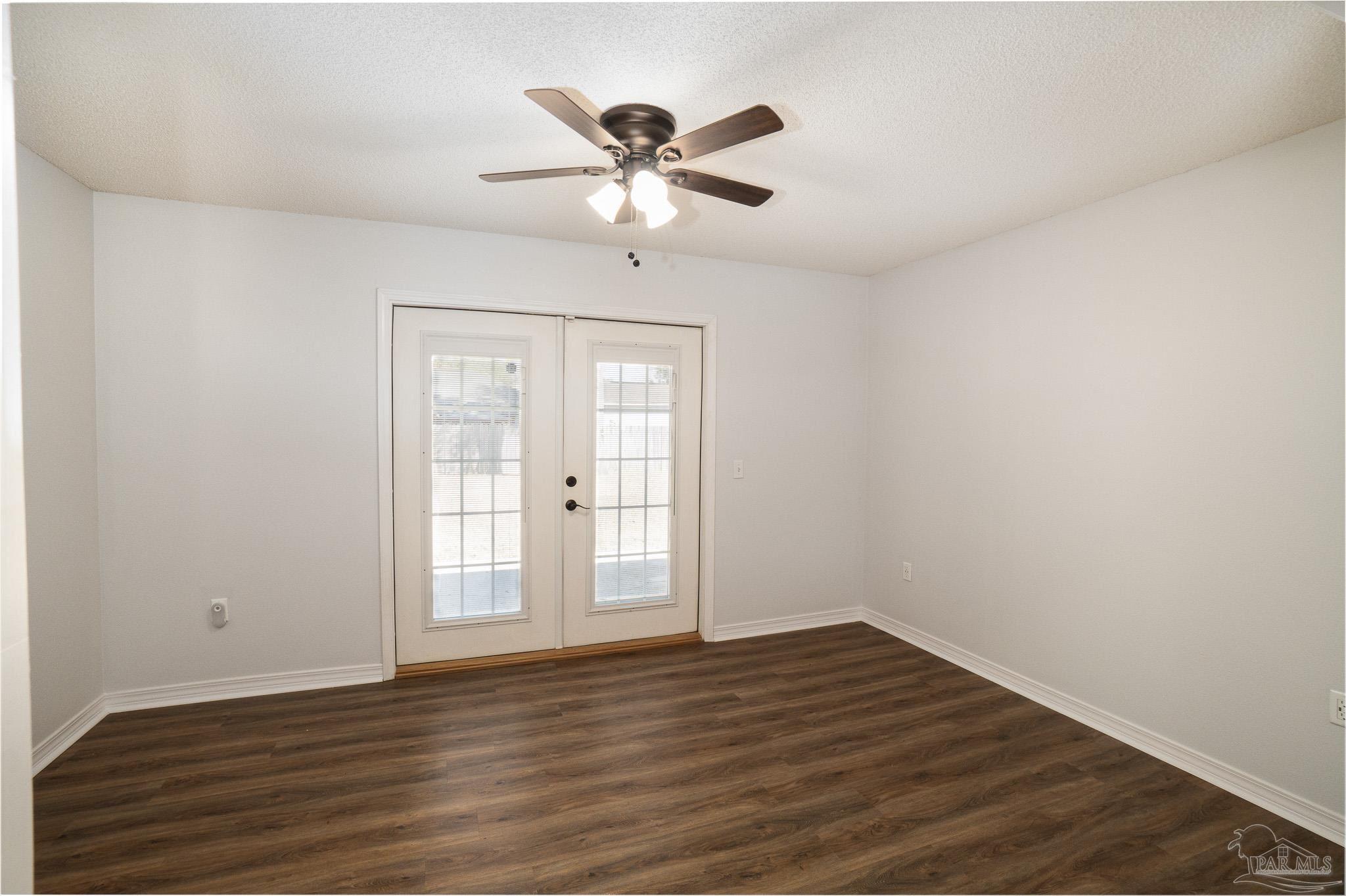 4836 Timber Ridge Drive Pace, FL 32571 - Photo 33 of 46 a view of empty room with wooden floor and fan