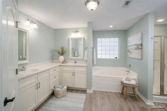 a bathroom with a bathtub shower sink and toilet