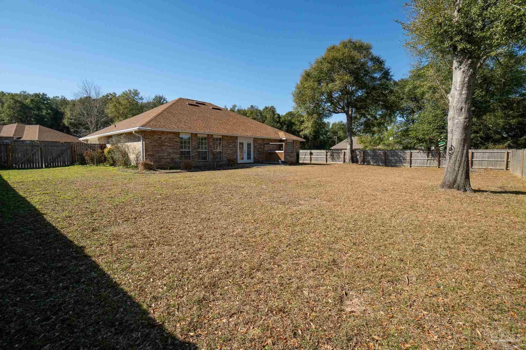 4836 Timber Ridge Drive Pace, FL 32571 - Photo 42 of 46 a front view of a house with a yard