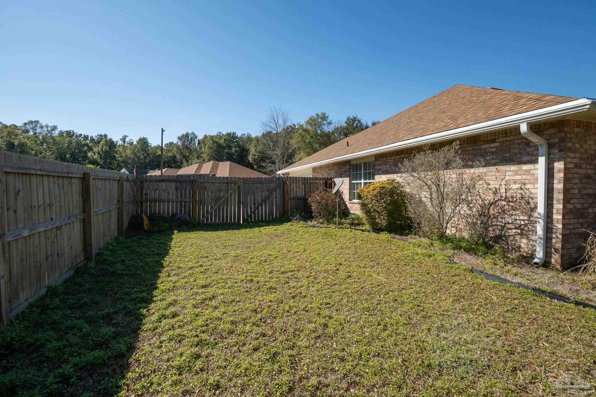 4836 Timber Ridge Drive Pace, FL 32571 - Photo 43 of 46 a view of a backyard