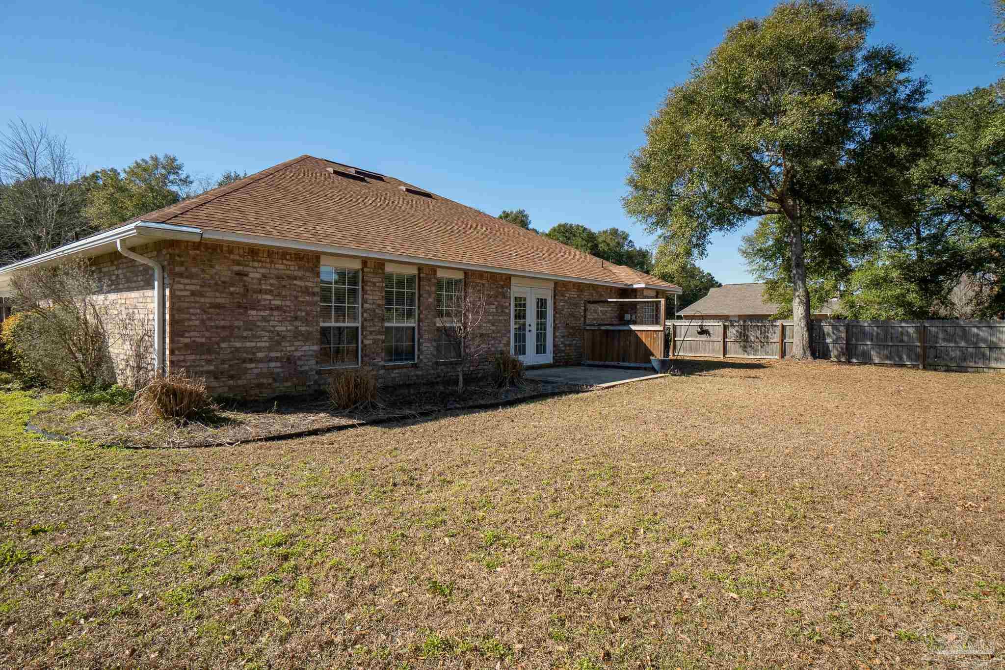 4836 Timber Ridge Drive Pace, FL 32571 - Photo 44 of 46 a front view of a house with a yard