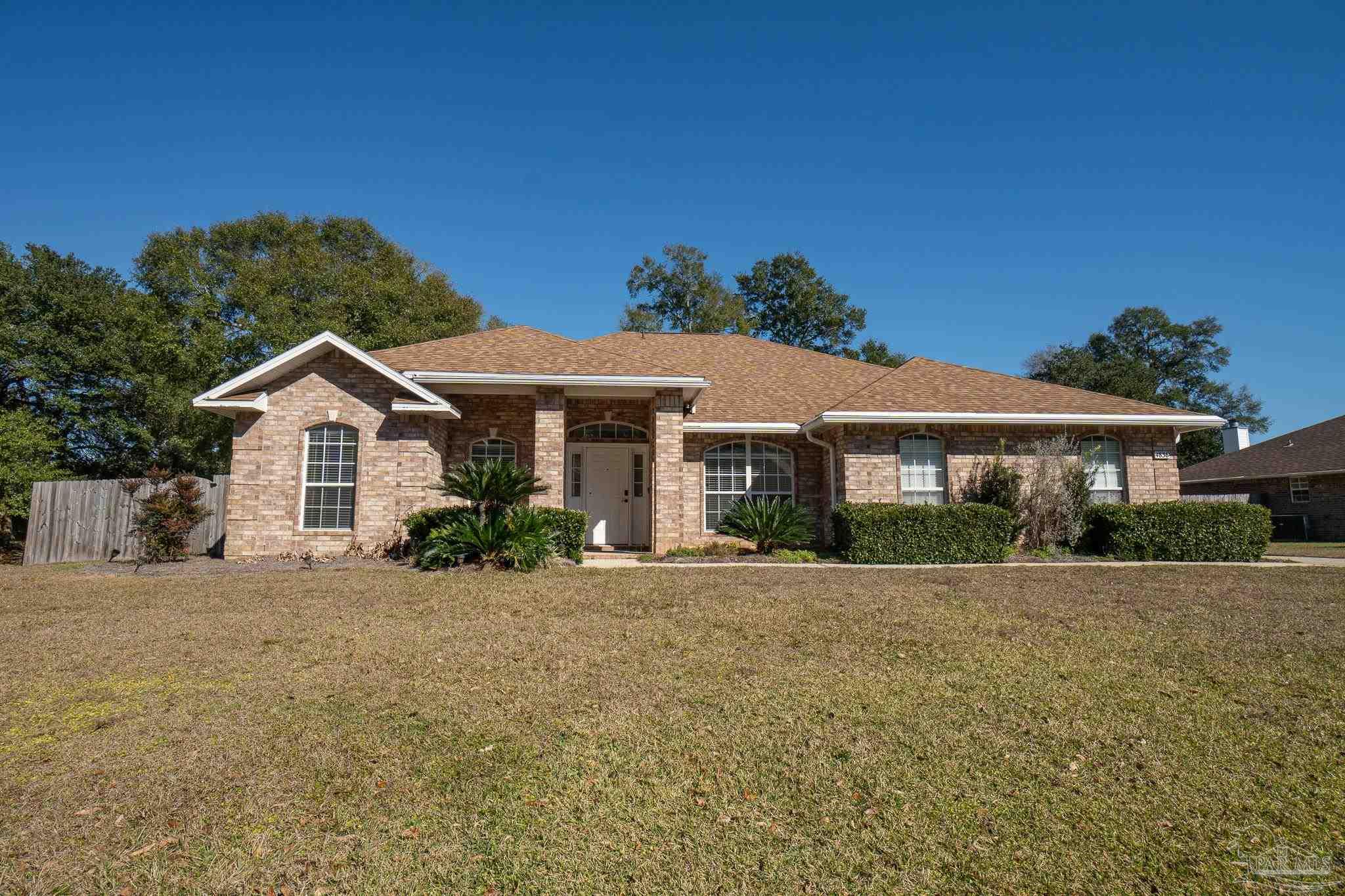 4836 Timber Ridge Drive Pace, FL 32571 - Photo 45 of 46 a front view of a house with a yard