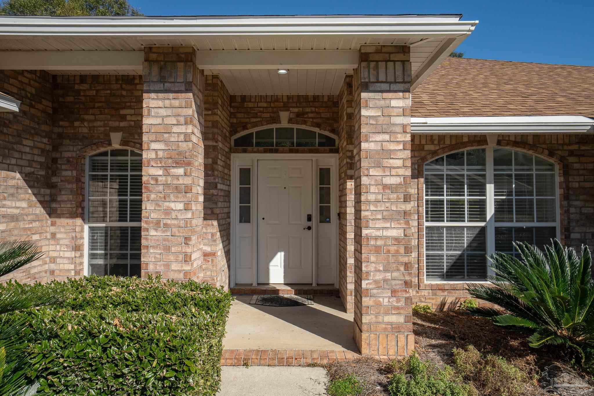 4836 Timber Ridge Drive Pace, FL 32571 - Photo 8 of 46 a front view of a house with a garage
