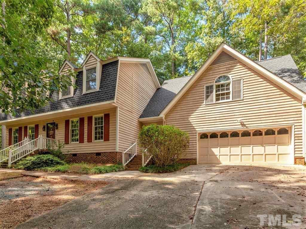3208 Brennan Drive Raleigh, NC 27613 - Photo 1 of 25 a front view of a house with a yard