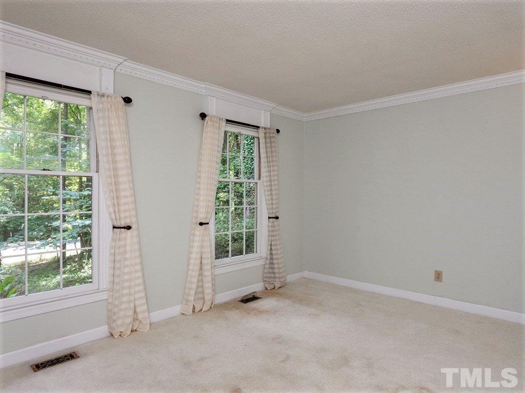3208 Brennan Drive Raleigh, NC 27613 - Photo 9 of 25 a view of an empty room with a window