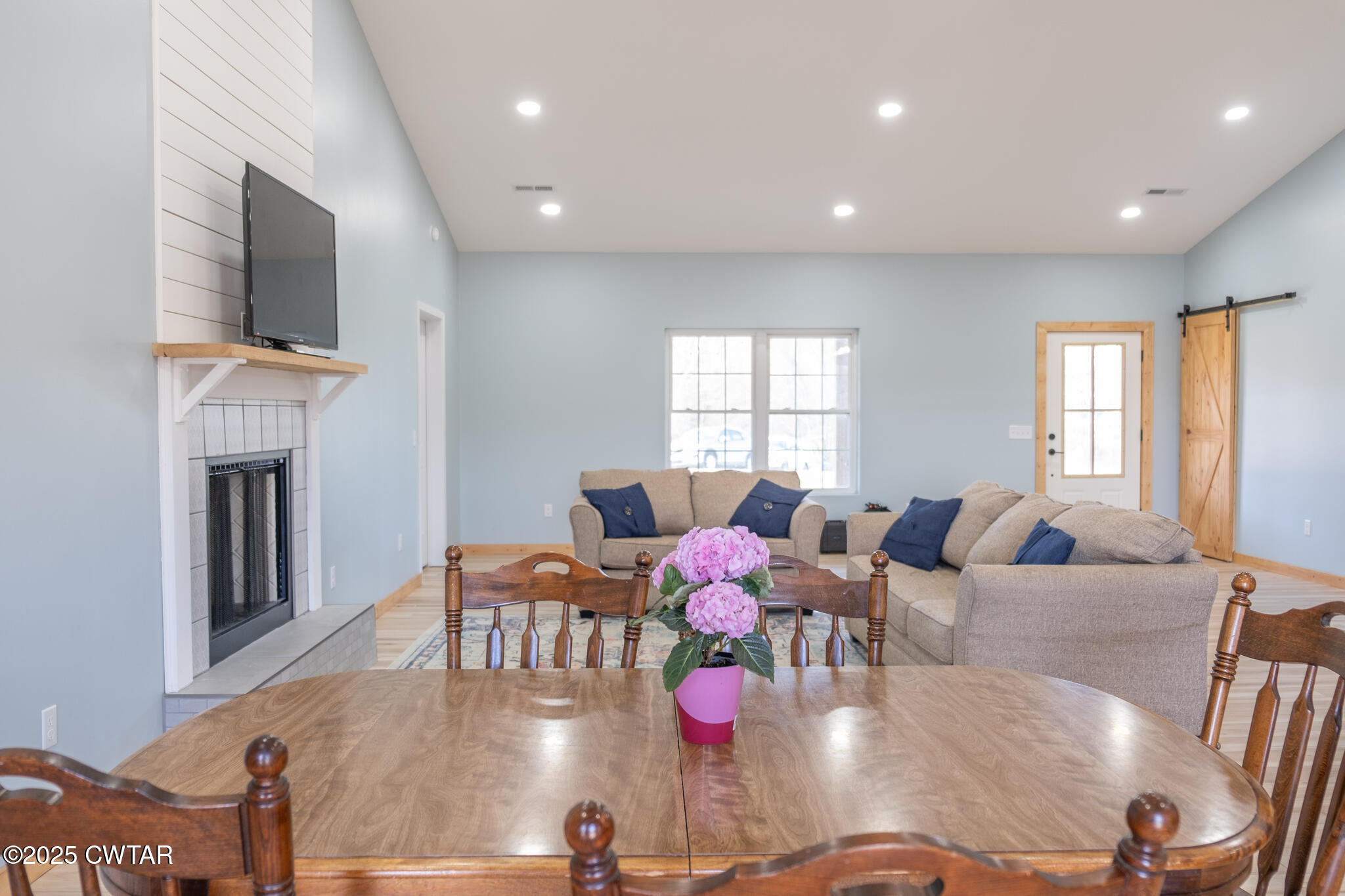 1375 White Clay Road Sharon, TN 38255 - Photo 15 of 58 a living room with fireplace furniture and a flat screen tv