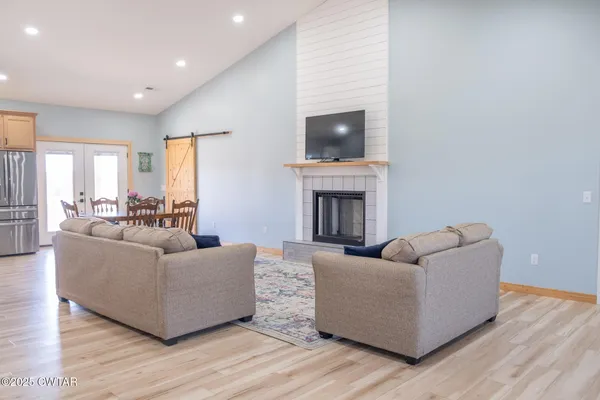 a kitchen with stainless steel appliances a stove a microwave and a refrigerator