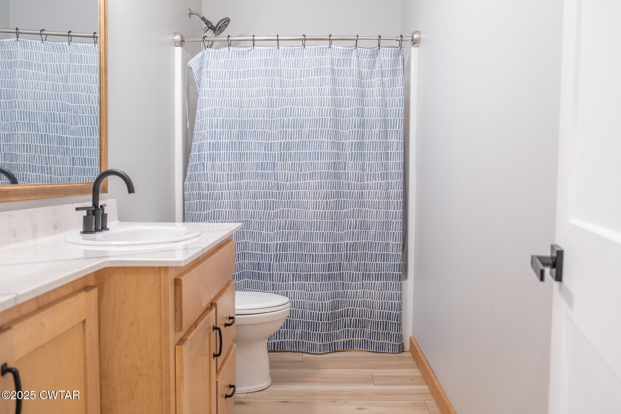 1375 White Clay Road Sharon, TN 38255 - Photo 24 of 58 a bathroom with a sink a toilet a mirror and shower