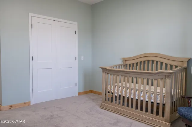 a bed room with a bed and a window