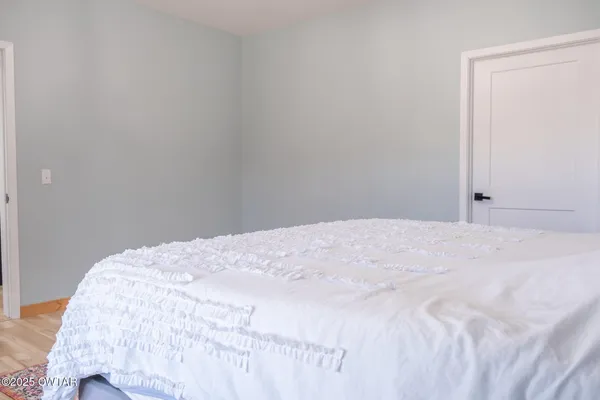 a bathroom with a white toilet and a sink