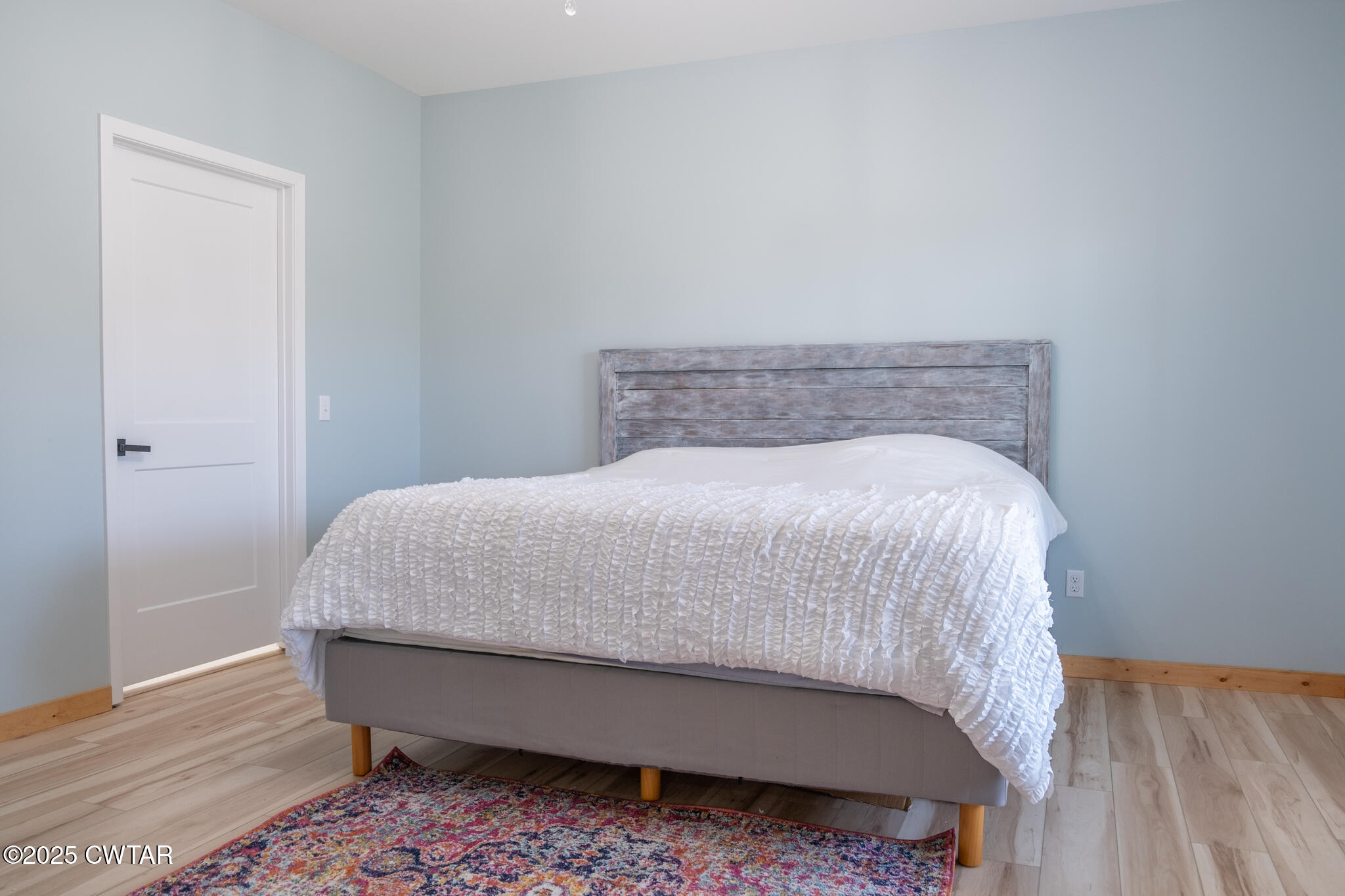 1375 White Clay Road Sharon, TN 38255 - Photo 40 of 58 a bed sitting in a bedroom next to a wooden cabinet