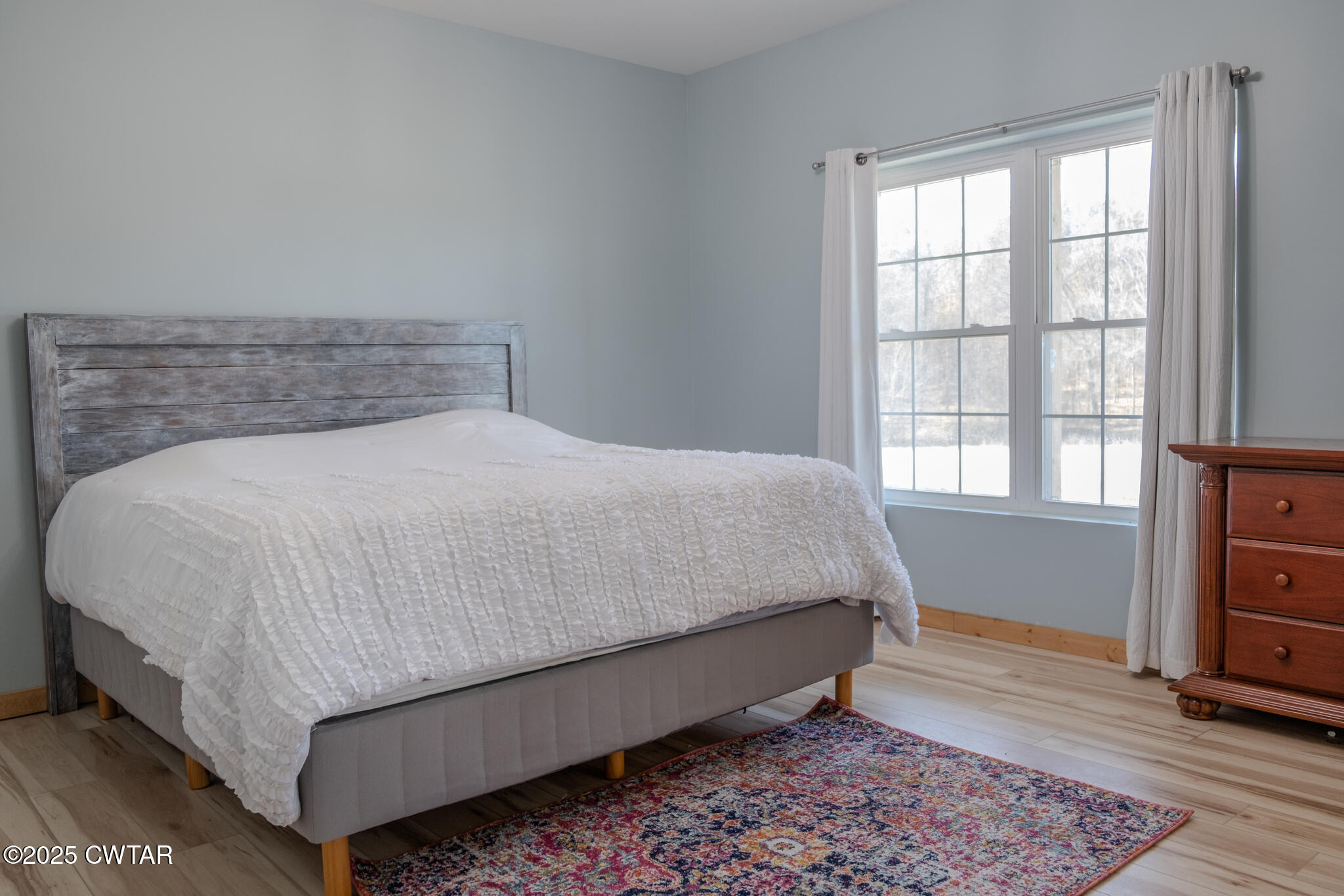 1375 White Clay Road Sharon, TN 38255 - Photo 41 of 58 a bed sitting in a bedroom next to a window