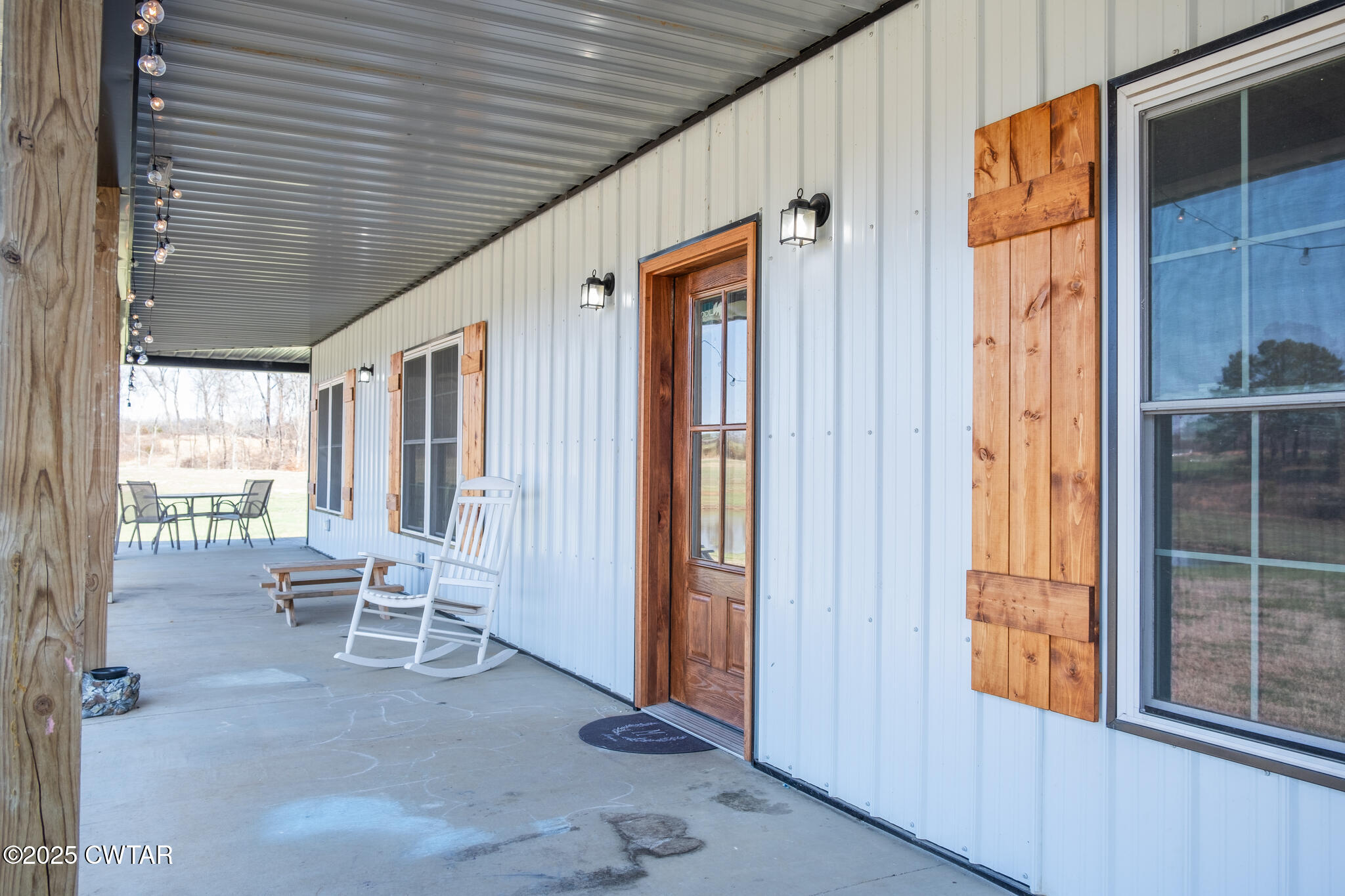 1375 White Clay Road Sharon, TN 38255 - Photo 48 of 58 a porch with a table and chairs