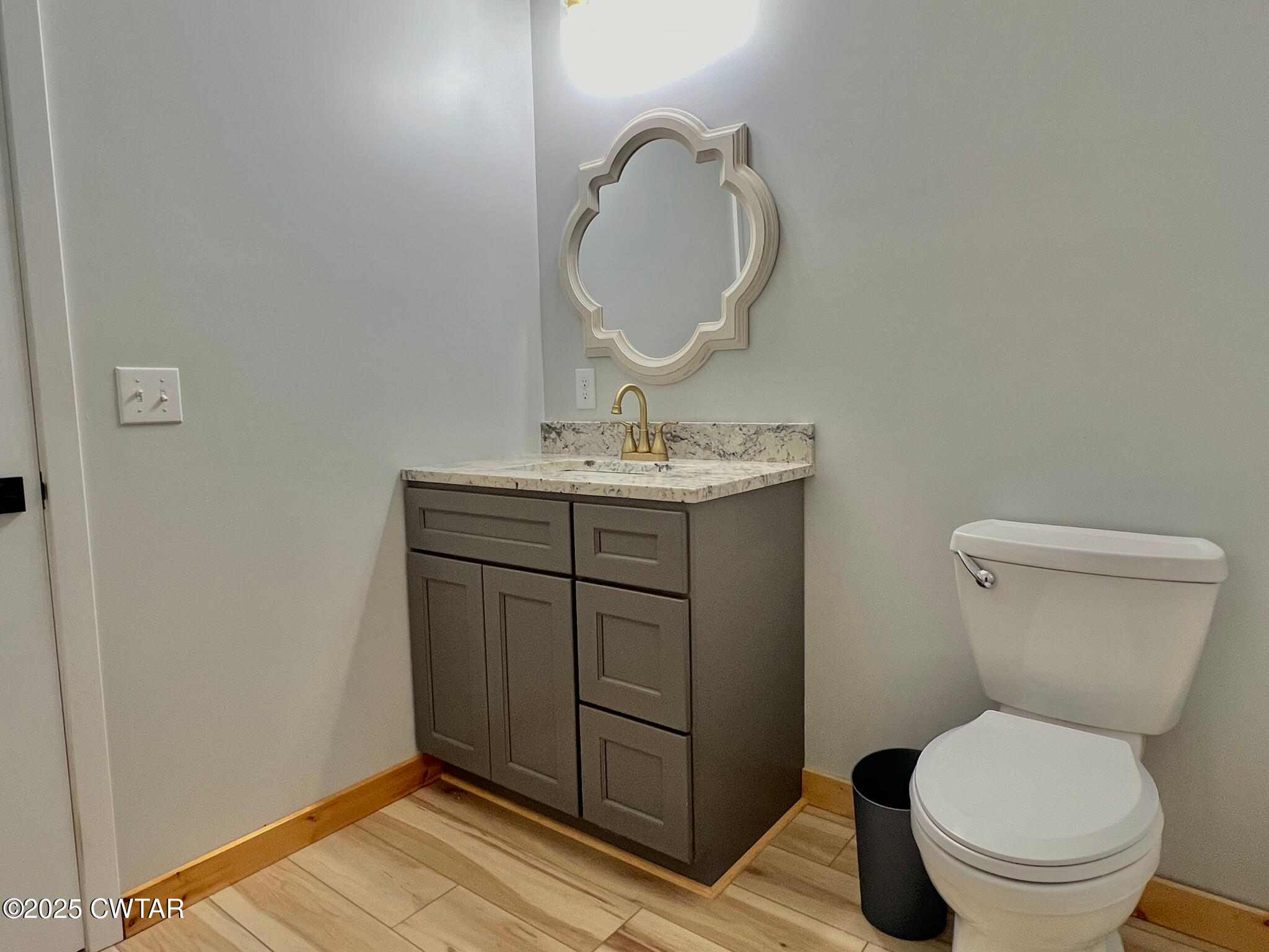 1375 White Clay Road Sharon, TN 38255 - Photo 56 of 58 a bathroom with a toilet a sink and mirror