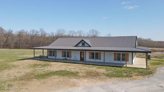 a kitchen with granite countertop a stove and a refrigerator