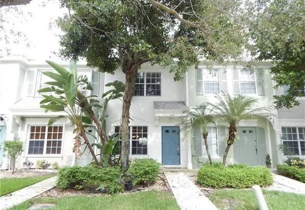 front view of a house with a small yard