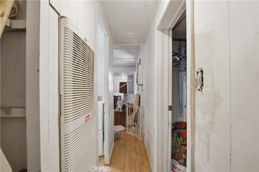 2465 Palermo Road, Unit 12 Palermo, CA 95968 - Photo 11 of 18 a view of a hallway with bathroom and wooden floor
