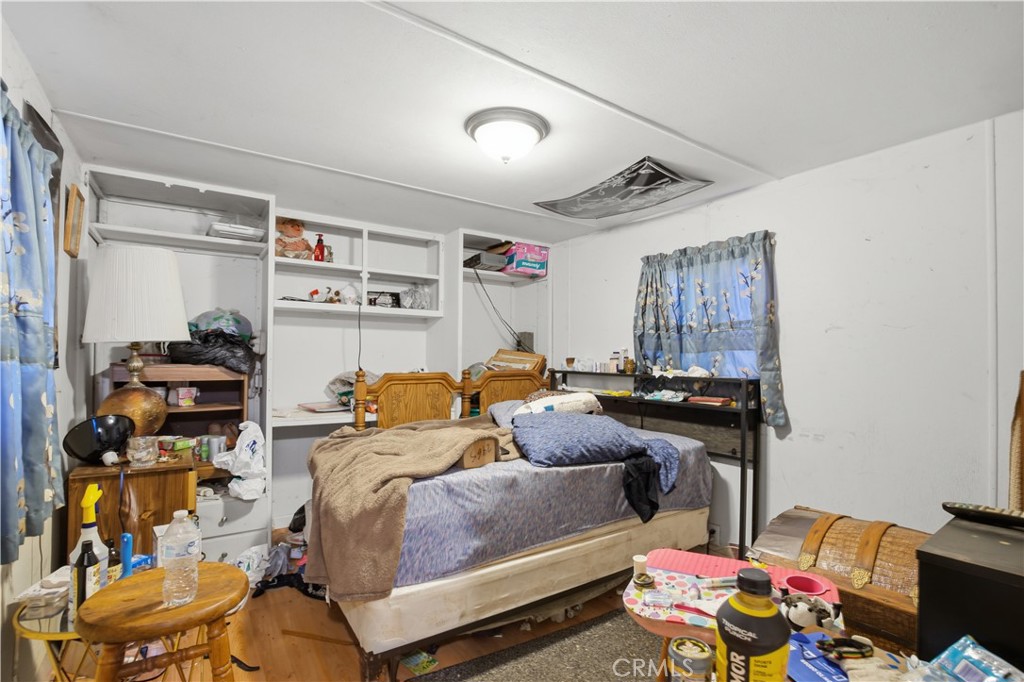 2465 Palermo Road, Unit 12 Palermo, CA 95968 - Photo 12 of 18 a bedroom with furniture and a gym equipment