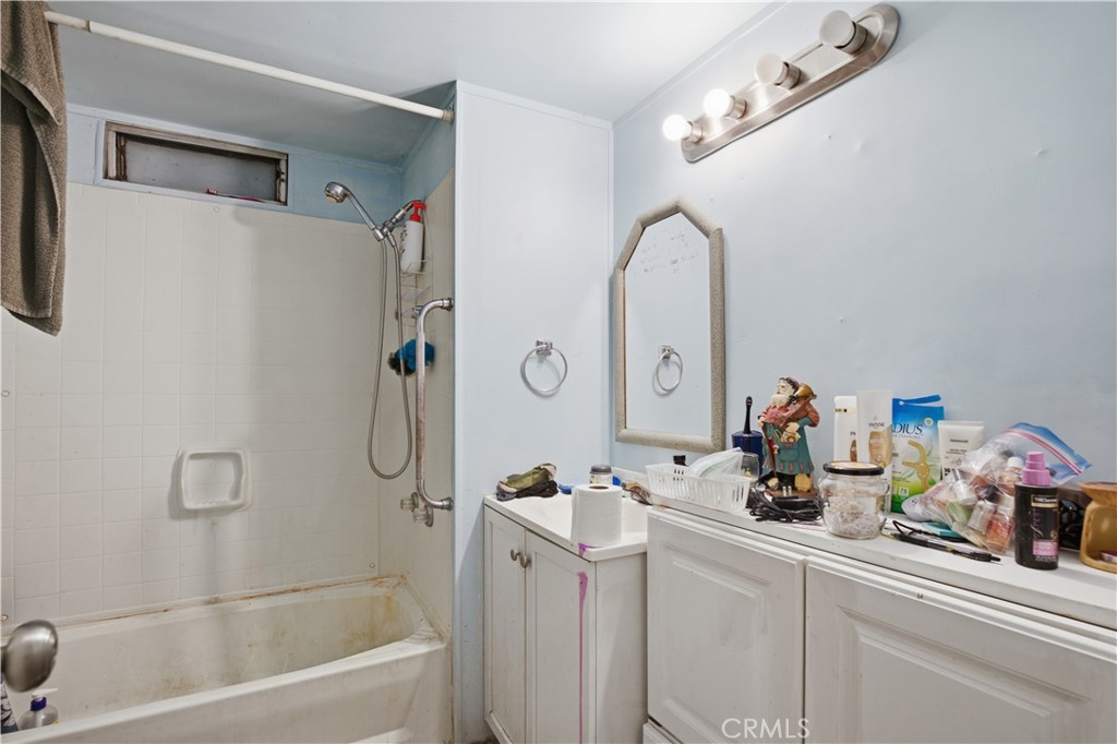 2465 Palermo Road, Unit 12 Palermo, CA 95968 - Photo 14 of 18 a bathroom with a sink a tub and a mirror