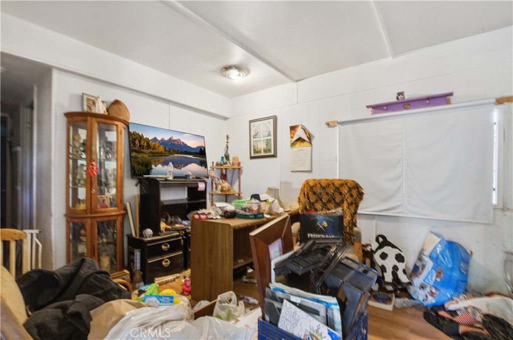 2465 Palermo Road, Unit 12 Palermo, CA 95968 - Photo 7 of 18 a living room with furniture and a flat screen tv