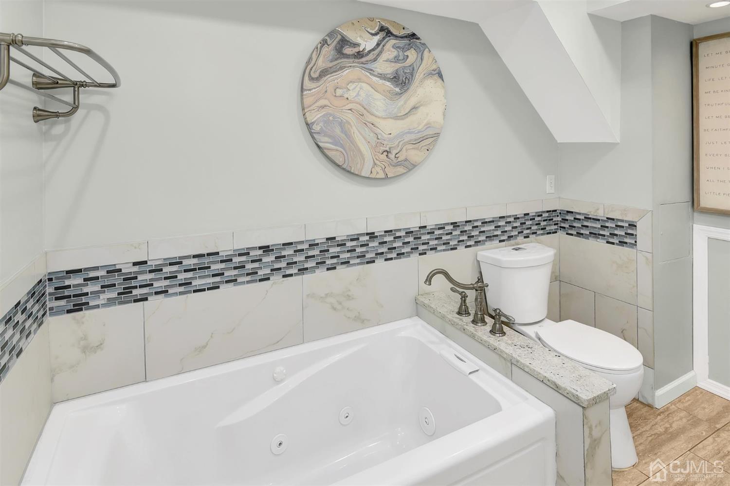 423 Ridge Road Dayton, NJ 08810 - Photo 11 of 29 a bathroom with a bathtub and a sink