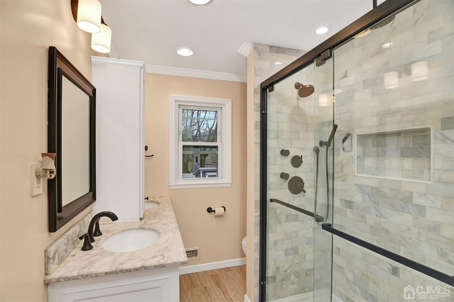 423 Ridge Road Dayton, NJ 08810 - Photo 15 of 29 a bathroom with a granite countertop sink mirror and shower