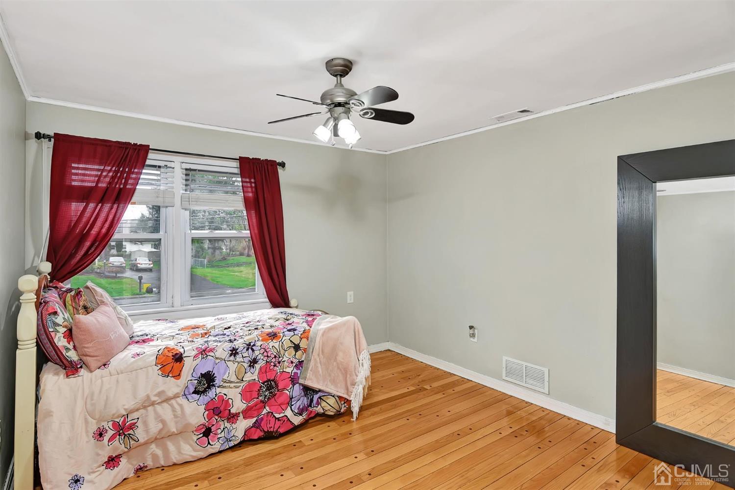 423 Ridge Road Dayton, NJ 08810 - Photo 16 of 29 a bedroom with a bed and a window