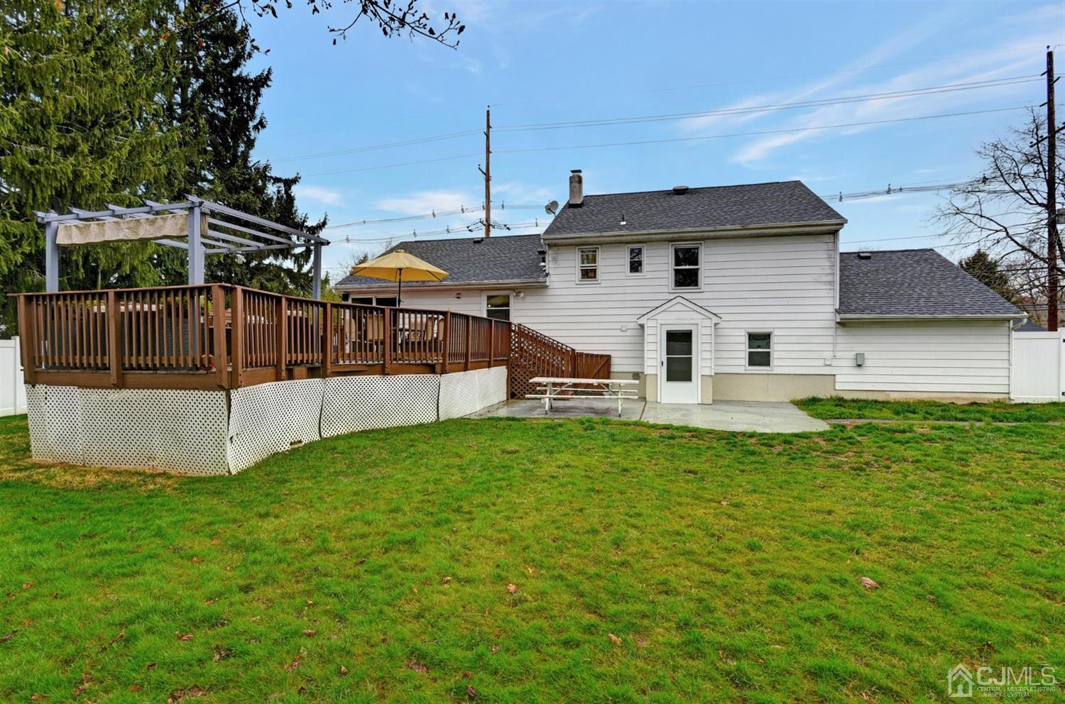 423 Ridge Road Dayton, NJ 08810 - Photo 23 of 29 a view of house with backyard and trees