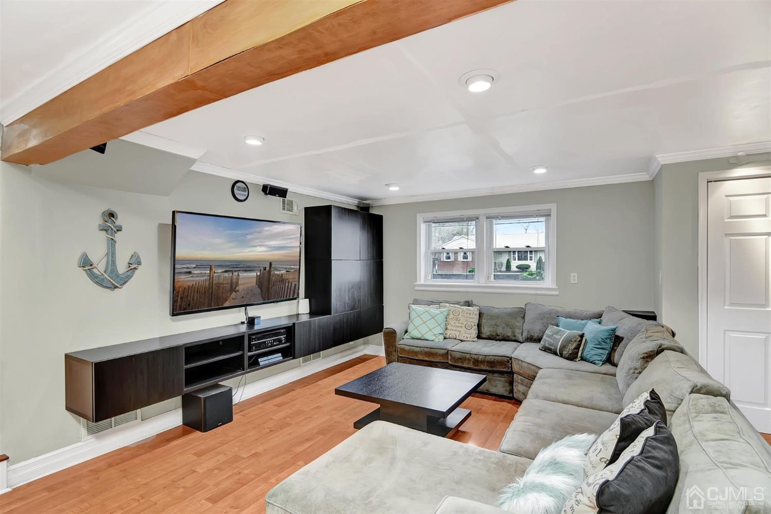 423 Ridge Road Dayton, NJ 08810 - Photo 7 of 29 a living room with furniture and a flat screen tv
