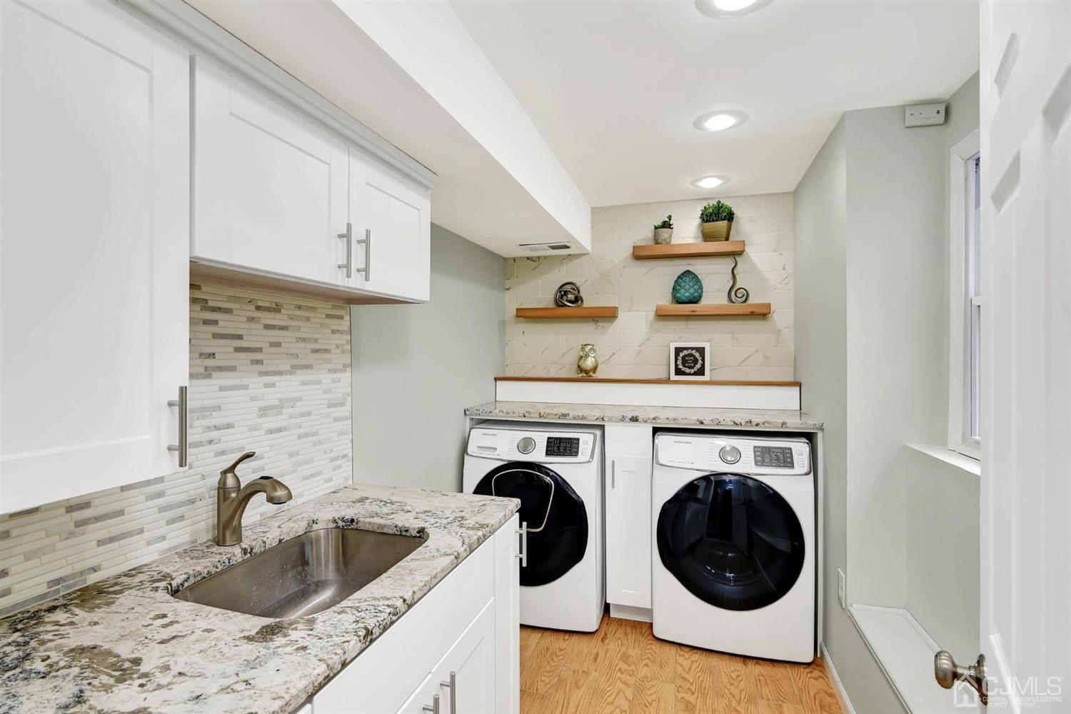 423 Ridge Road Dayton, NJ 08810 - Photo 9 of 29 a utility room with sink dryer and washer