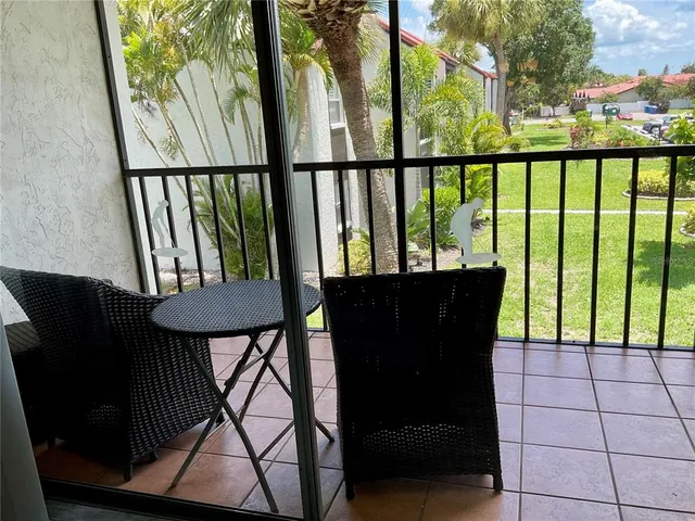a table and chairs in a balcony
