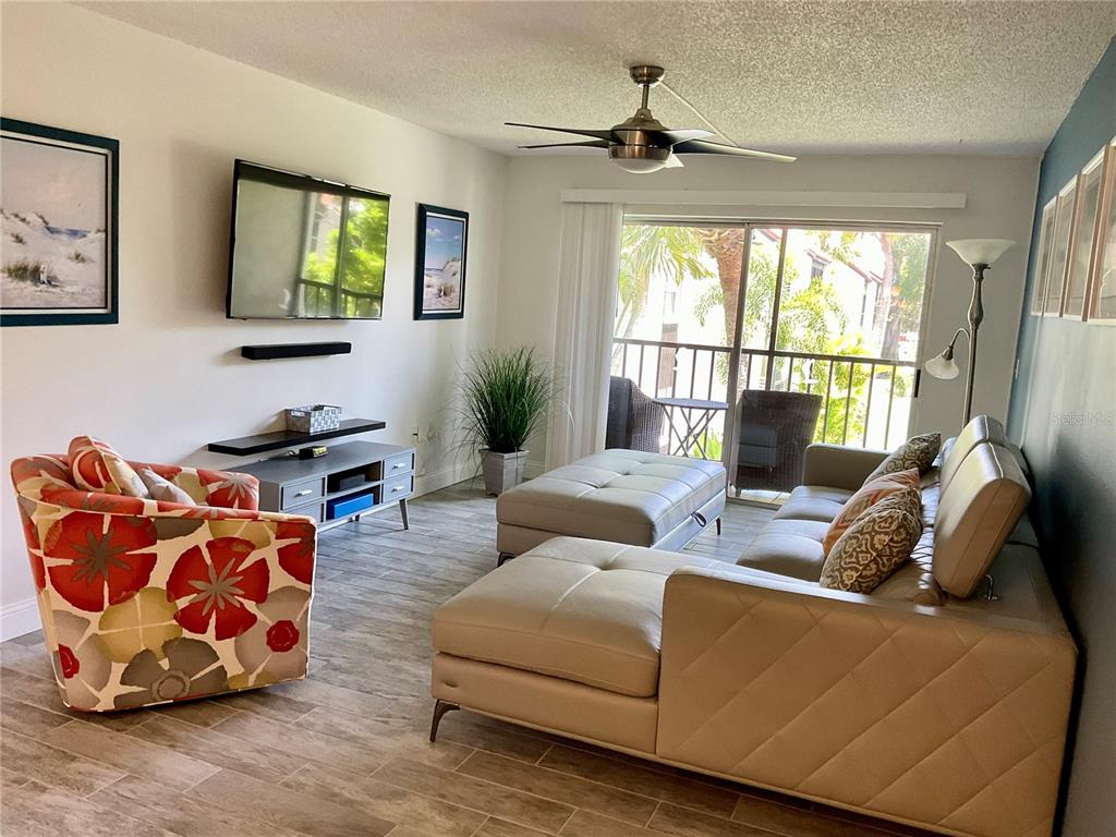 3213 South Beneva Road, Unit 204 Sarasota, FL 34232 - Photo 3 of 18 a living room with furniture and a window