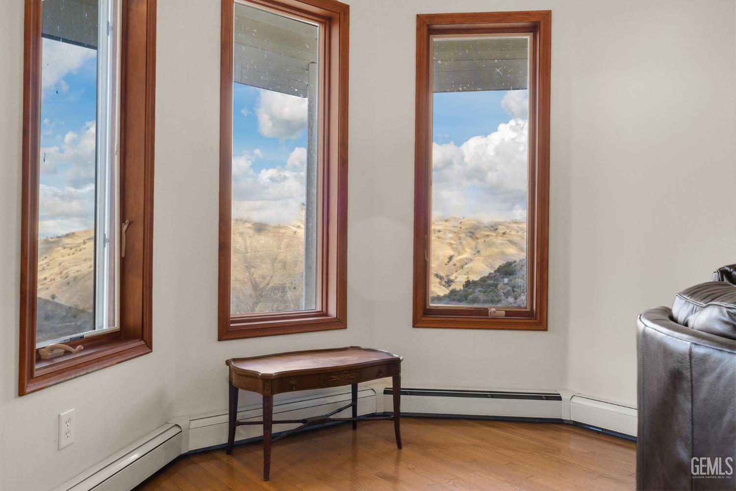 Undisclosed Address Lebec, CA 93243 - Photo 9 of 49 a view of an empty room with window and wooden floor
