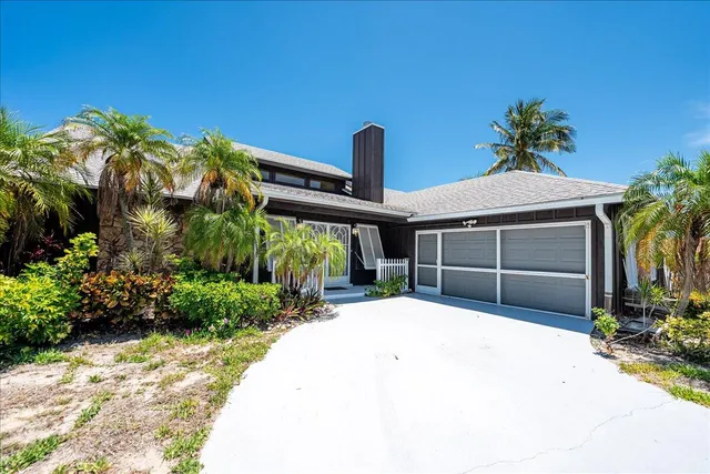 a view of a house with garden and plants