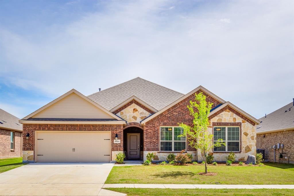 2824 Grizzly Road Aubrey, TX 76227 - Photo 1 of 1 a front view of a house with a yard and garage