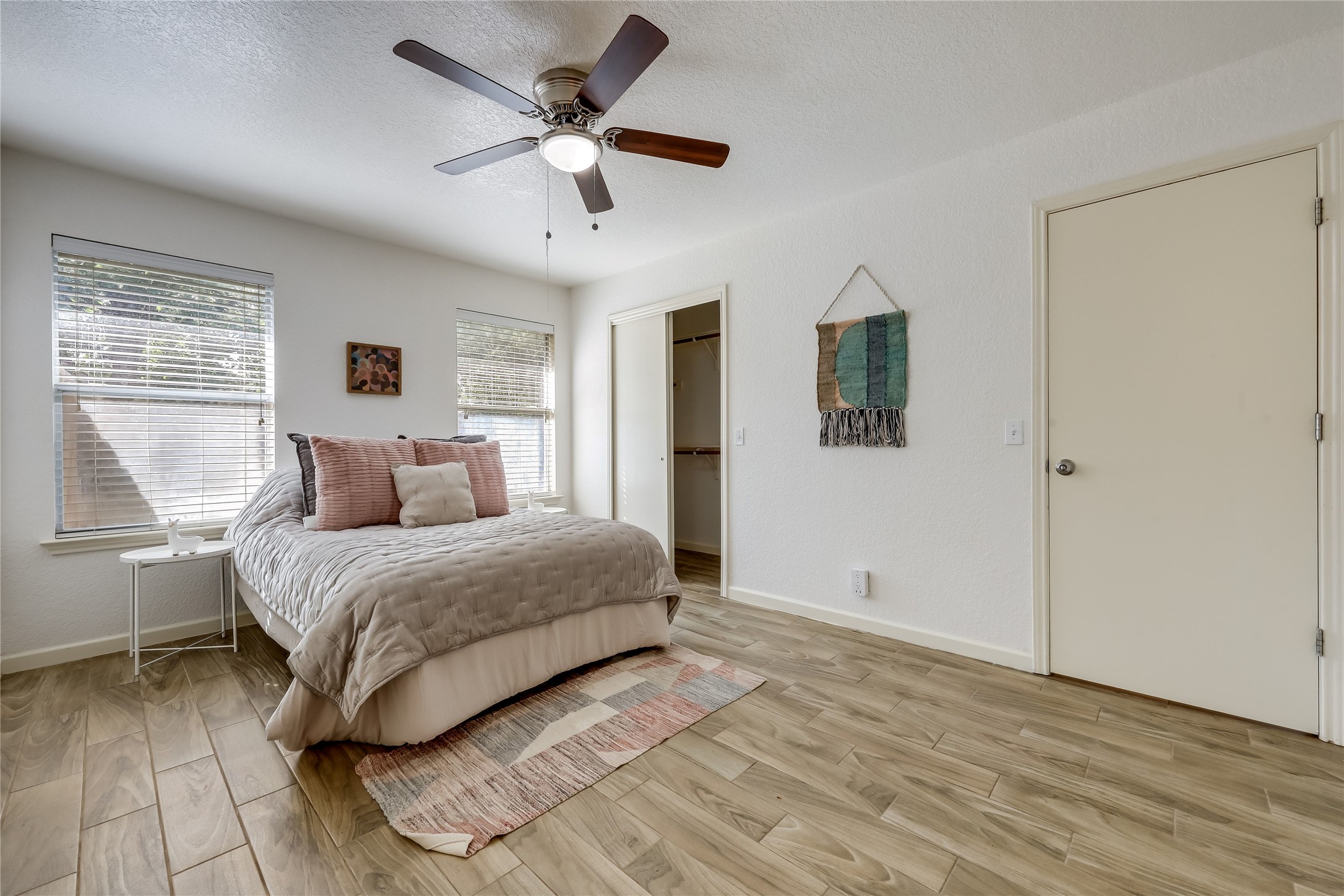 4510 Secure Lane Austin, TX 78725 - Photo 11 of 24 a spacious bedroom with a bed and a window