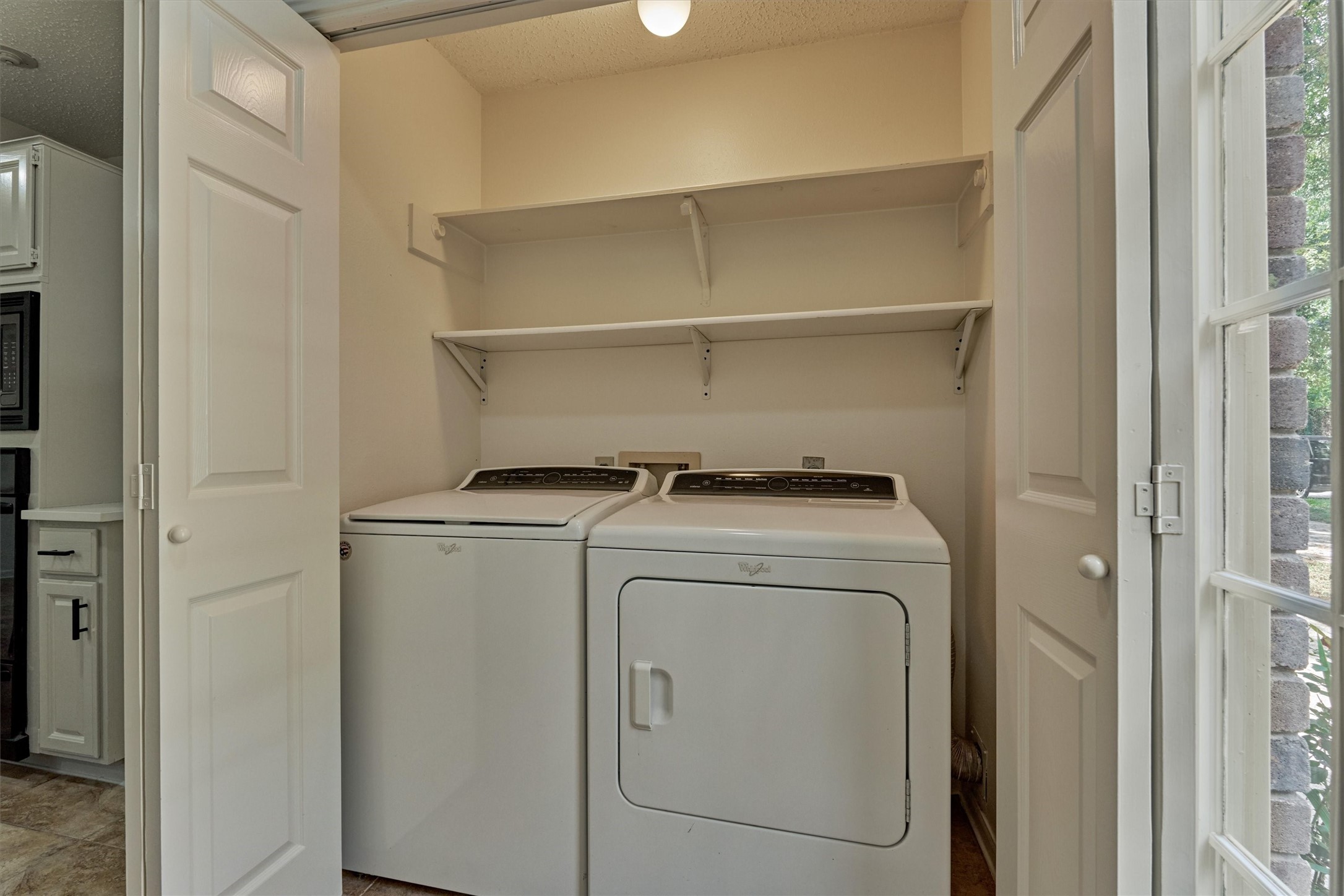 71 Breezy Point Place Spring, TX 77381 - Photo 23 of 40 Laundry area with shelves and doors.