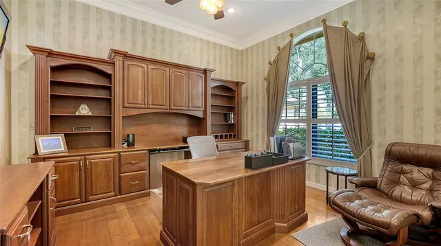 a view of a dining room with furniture wooden floor and chandelier