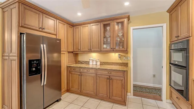 a bathroom with a sink vanity and a mirror