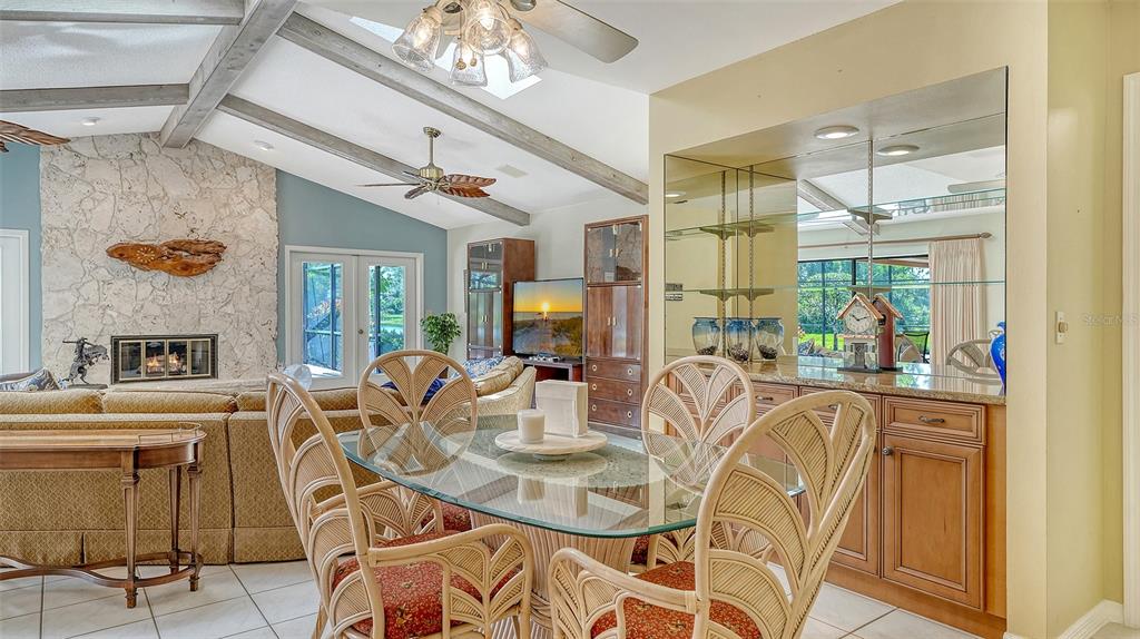 7426 Weeping Willow Boulevard Sarasota, FL 34241 - Photo 27 of 66 a view of a dining room with furniture window and wooden floor