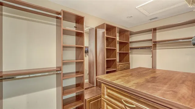 a bed room with a bed and a large window