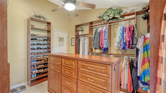 a living room with large glass windows and a table