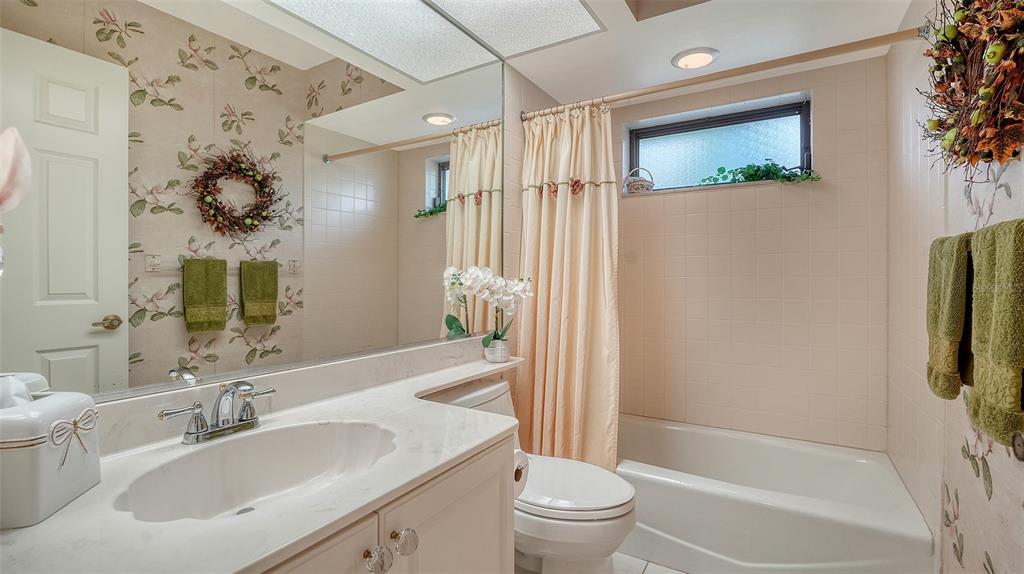 7426 Weeping Willow Boulevard Sarasota, FL 34241 - Photo 41 of 66 a bathroom with a sink toilet and shower