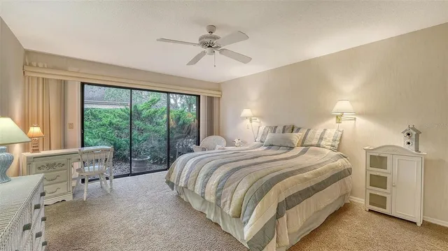 a view of a lake with a tree in the background