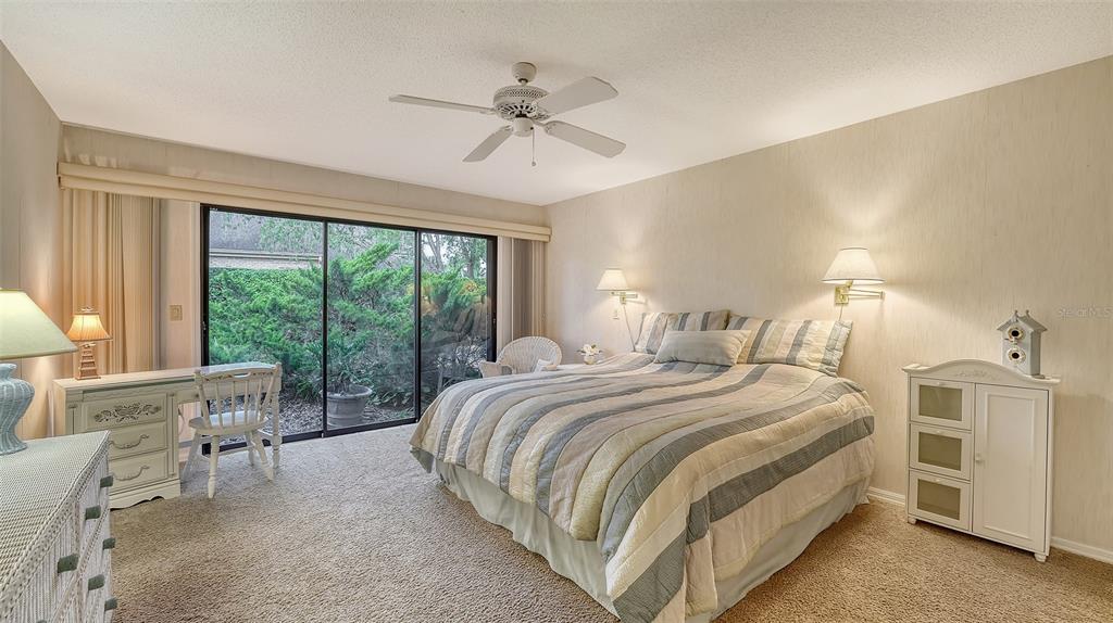 7426 Weeping Willow Boulevard Sarasota, FL 34241 - Photo 42 of 66 a bed room with a bed and a large window