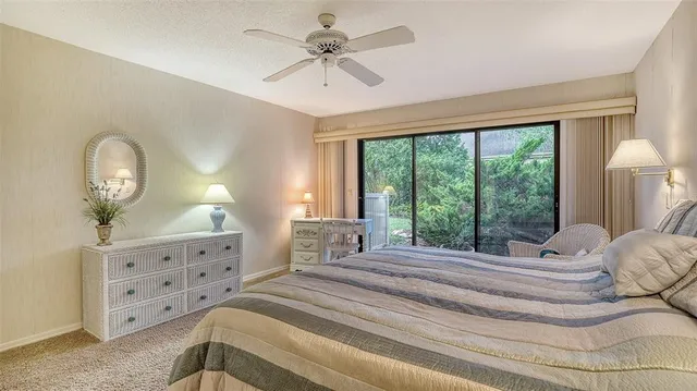 a view of a lake with houses in the back