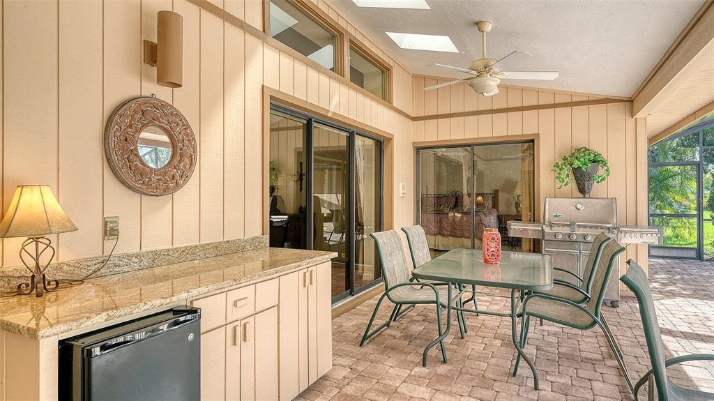 7426 Weeping Willow Boulevard Sarasota, FL 34241 - Photo 48 of 66 a very nice looking dining room with a large window and chandelier
