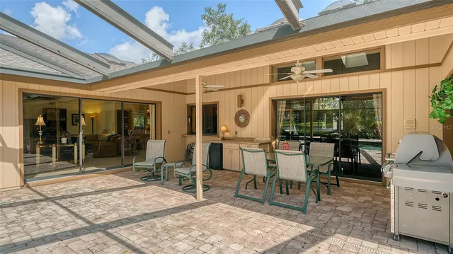 a view of a bench in a garden near a lake