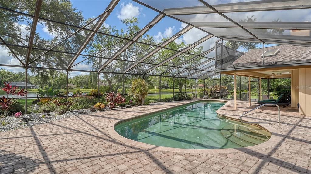 7426 Weeping Willow Boulevard Sarasota, FL 34241 - Photo 52 of 66 a view of a swimming pool with a patio