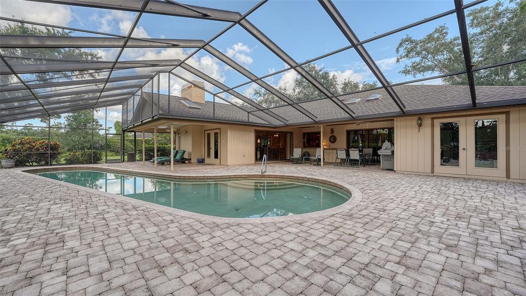 7426 Weeping Willow Boulevard Sarasota, FL 34241 - Photo 54 of 66 a view of a swimming pool with a patio